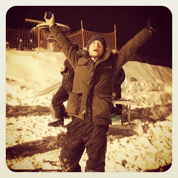 Producer having fun with wine on ski slope!