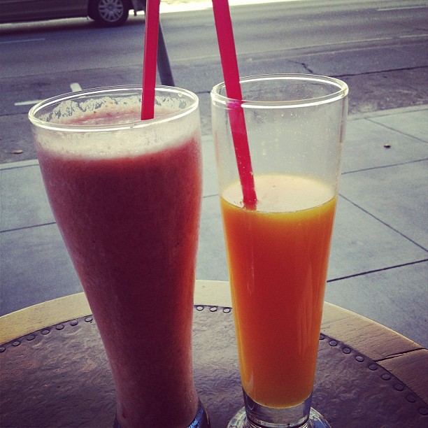 Strawberry smoothie and fresh orange juice